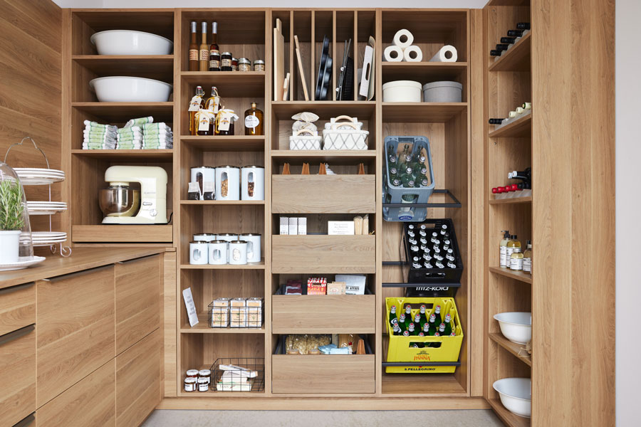 A natural wood pantry with neatly organised dry food goods