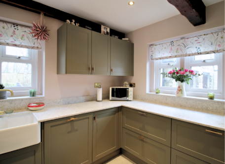 Sage green cabinets installed as part of a kitchen renovation in Stalybridge, Cheshire.