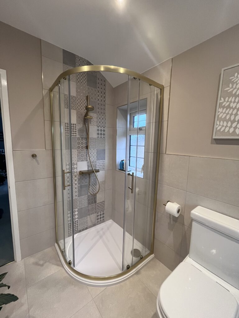 Brushed brass corner shower enclosure 